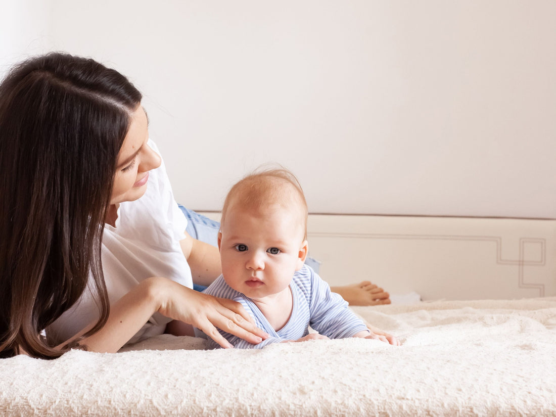 Mother and baby in bed