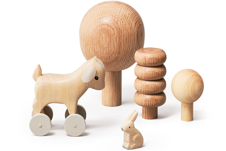Set of wooden toys including a horse with wheels, a rabbit, and various stacked rings on a white background.